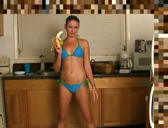 Haily Young enjoys food fetish and fucks pussy with bananas in kitchen