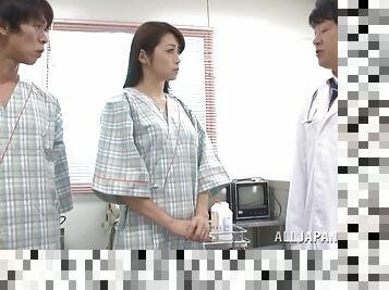 Kinky doctors probe a Japanese girl's hairy pussy in an exam room