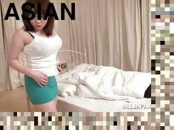 Breathtaking Asian dame with big tits in miniskirt awarding massive dick with handjob