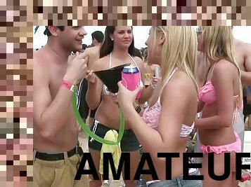 Amateur cuties wearing bikinis get caught on a voyeur's cam on a beach
