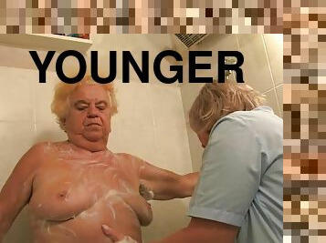 A younger guy showers, toys then fucks a very old granny