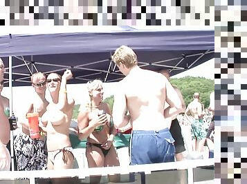 Topless bikini babe on a party boat gives a hot lap dance