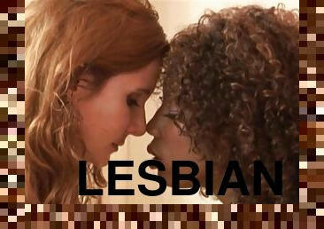 Lesbian Interracial Scene feat curly ebony chick Misty Stone kissing and petting her redhead girlfriend