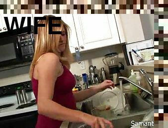 Hot wife washing the dishes in her bra