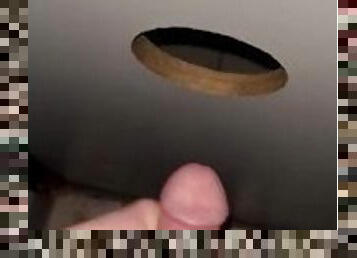 Playing with my cock at the gloryhole