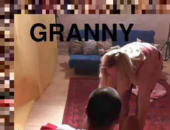 Granny nymph teaching a boy how to please a woman