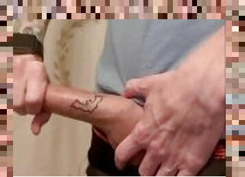 Tattooed guy jerks tattooed cock