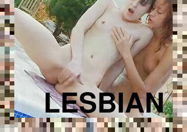 Sweet lesbian girlfriends making love in the pool