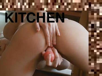 Girl fingering hole in the kitchen