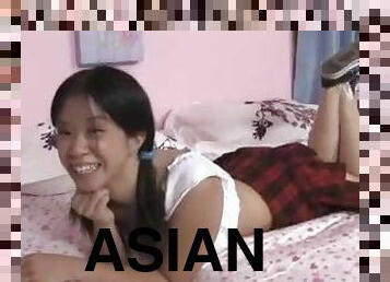 Asian schoolgirl in pigtails giving BJ