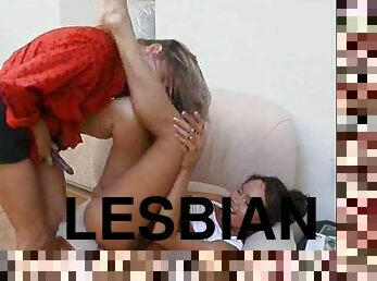 Lesbians are dressed and having anal sex