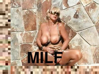 Solo milf in shiny pantyhose outdoors