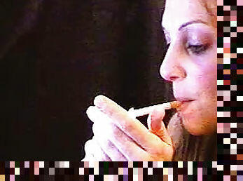 She sits on webcam and smokes sensually