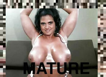 Solo mature star Kailani Kai takes off her bikini to masturbate