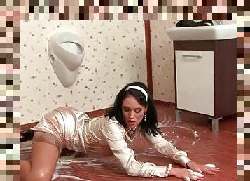 Classy satin girl rolls around in goo on floor