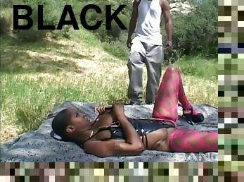 On a blanket out in the forest a black girl is fucked hard