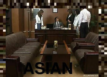 Multiple Asian women work to please their boss in his office