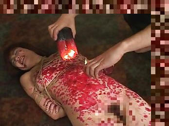 Kinky Asian slavegirl gets drenched in molten wax
