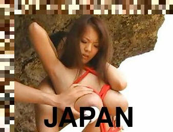 Fondling huge tits Japanese girl on beach