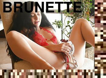 Brunette April wearing red lingerie enjoys while fingering herself