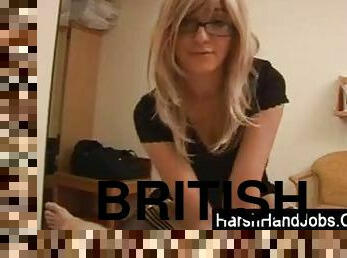 Clothed British girl giving a handjob