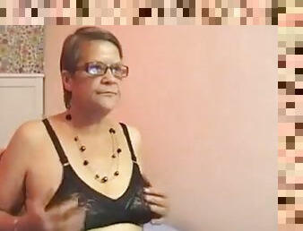 Ugly granny strips naked in front of the webcam