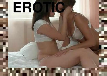 Two young women in erotic girl on girl foreplay