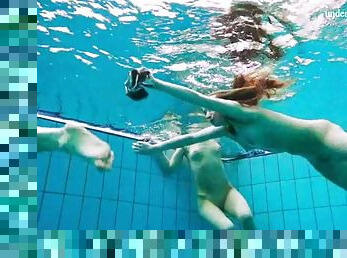 Three teen friends strip in the swimming pool