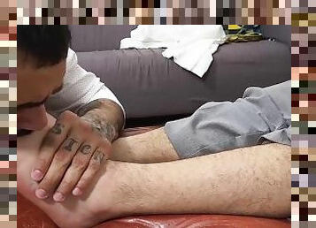 Tattooed hung jock Danny masturbates while foot worshipped