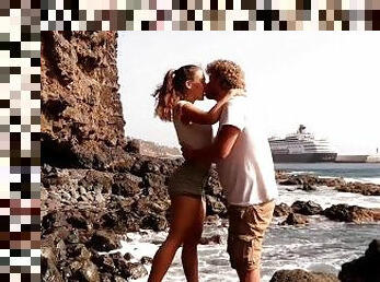 Beautiful Couple in Love Passionately Kissing on a remote island