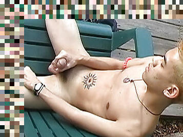 Teen redhead with tatts strokes his dick outdoors