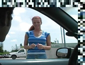 Crazy redhead Brandi Mae gives head in the back of a car