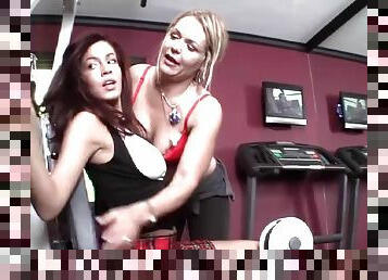 Lesbian kissing and foreplay in the gym