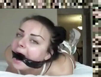 My deepthroat slut is hogtied on my bed and shows me her deepthroat skills.