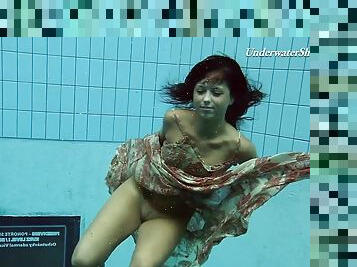 Russian teen diving while showing off her natural tits