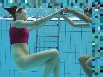 Classy Russian lesbian teen enjoying swimming in the pool