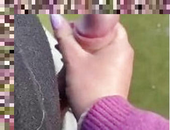 Hand job outside in soccer field