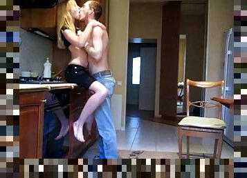 Blonde teen is fucked on the kitchen counter by her boyfriend
