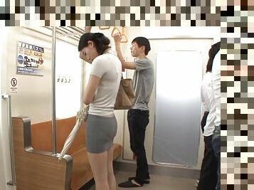 Asian slut sucks on two hard cocks in a subway