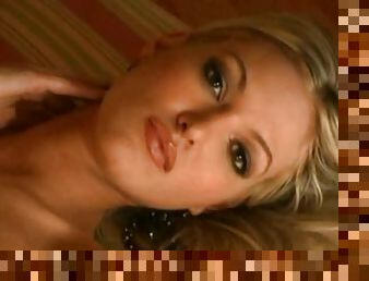 Gorgeous blond Nikki Kelley fools around the house naked