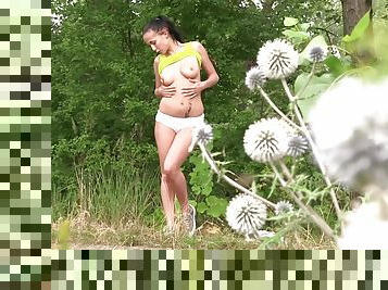 Nicole Love masturbates in the nature using her long fingers