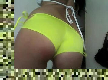 Naomy Waters dances in toxic yellow panties in front of the webcam