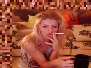 Smoking blonde stripteasing and having fun on webcam