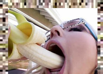Blonde Christie Stevens sucking a banana before sucking a dick