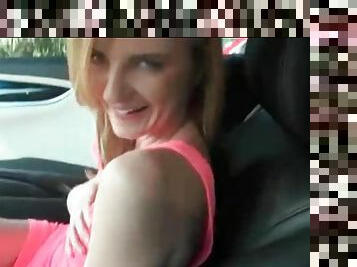 Skinny blonde teases her tits and pussy in the car