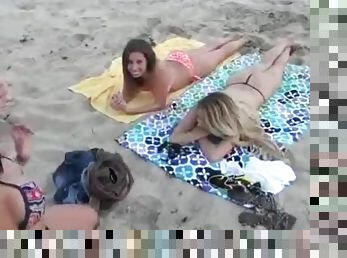 Skinny blonde flashes her sexy tits on the beach
