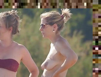 Topless milf and her pregnant friend at the beach