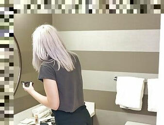 Flat chested blonde plays with her cunt in the bathroom