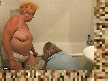 Granny gets in the tub for a sponge bath from her nurse