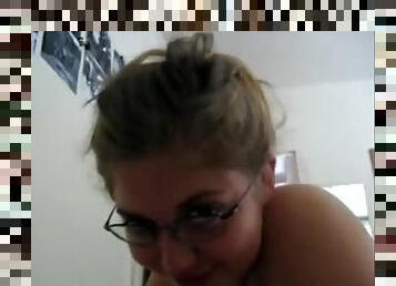 Brown-haired girlfriend with glasses sucking a big dick